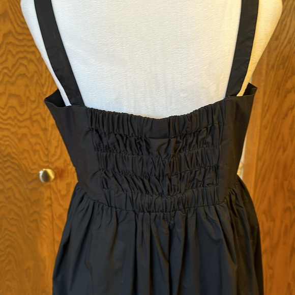 A New Day black dress size medium with a tan Universal Thread cross body purse. - Picture 7 of 16